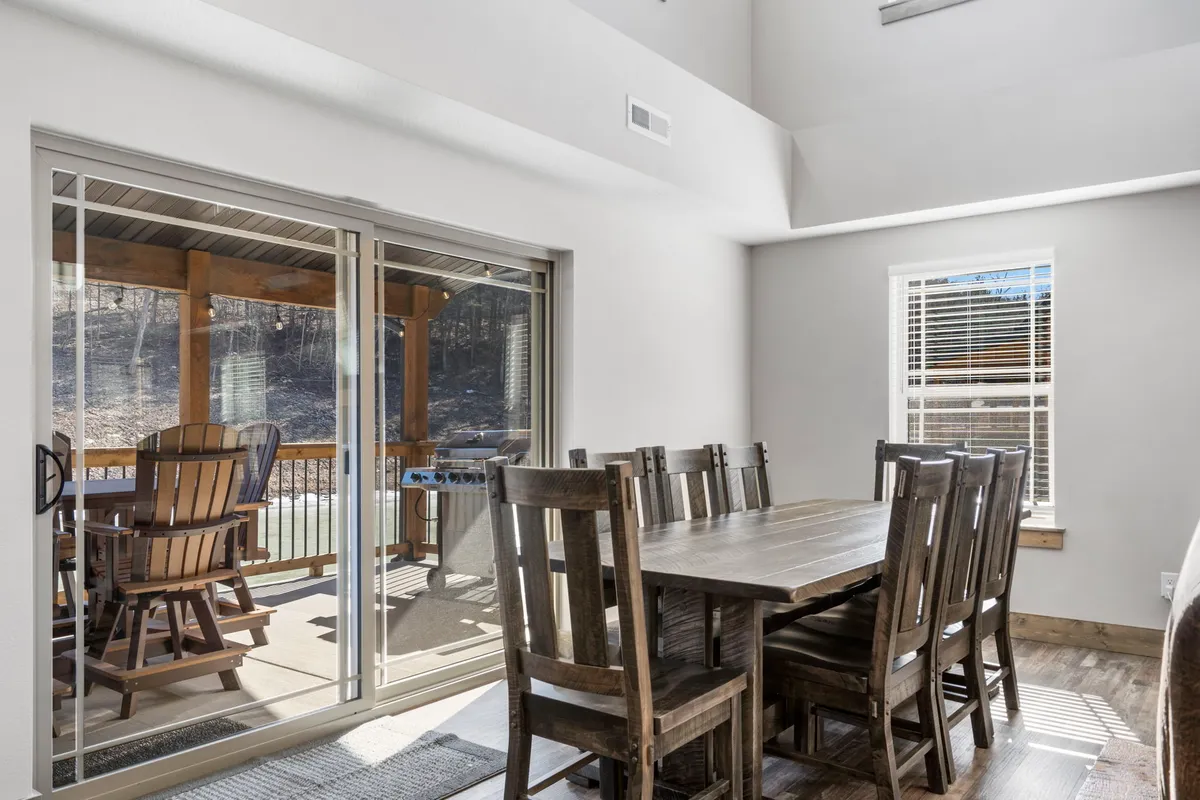 This community center scene showcases a large swimming pool bordered by tennis courts and nature trails, surrounded by greenery. The setup is vibrant and recreational, perfect for families looking to unwind or stay active together.